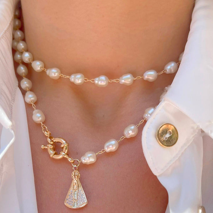 <p>Collar nuestra señora aparecida con Perla en baño de oro18k  </p> <p>tamaño 80cm </p> <p>joyas hipoalergenicas y sin niquel</p>